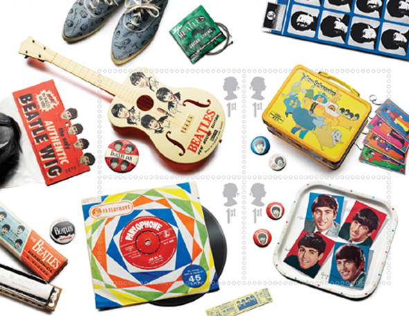 Royal Mail Miniature sheet of 1st class Beatles stamps showing memorabilia - guitar, lunchbox, 45rpm single, tea tray.