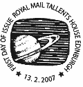 postmark showing Saturn and stars on television screen.