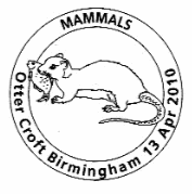 Postmark showing an otter eating a fish.