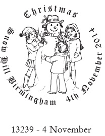 Christmas stamp postmark showing children building a snowman.