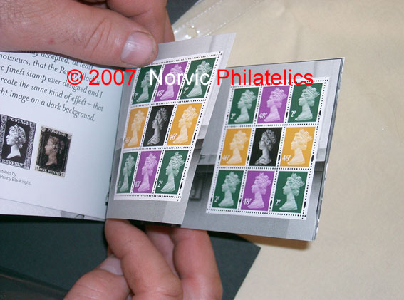 photograph showing Machin Anniversary prestige stamp book with 
pane 1 duplicated.